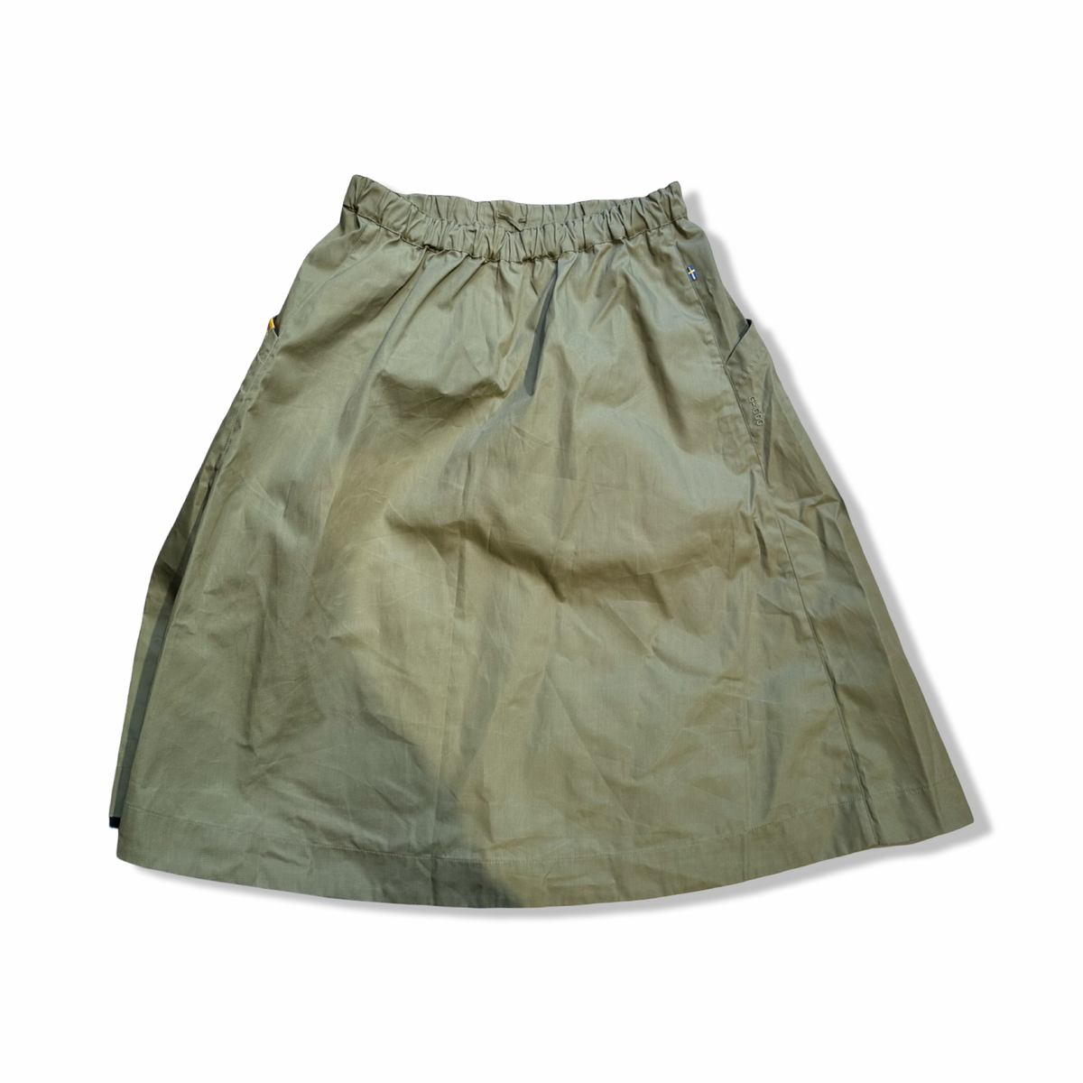 Green Fjällräven Vardag women's skirt with elastic waist, front view against a white background.