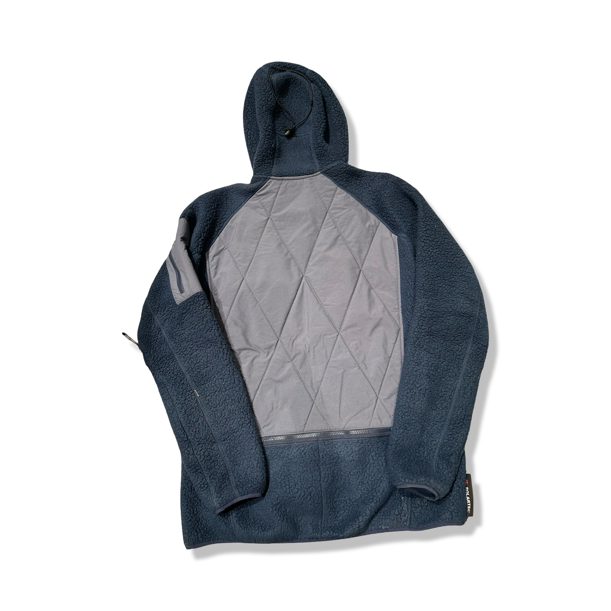 Baksidan av en blå Haglöfs IC3 MTN Fleece fleecetröja för herr, fotograferad mot en vit bakgrund.