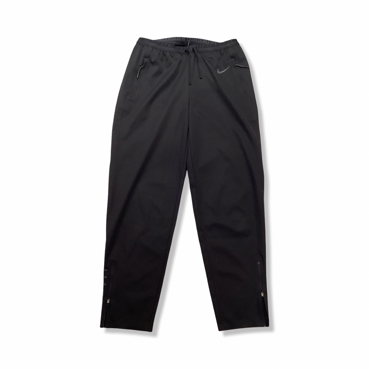 Black Nike women's training pants, front view against a white background.