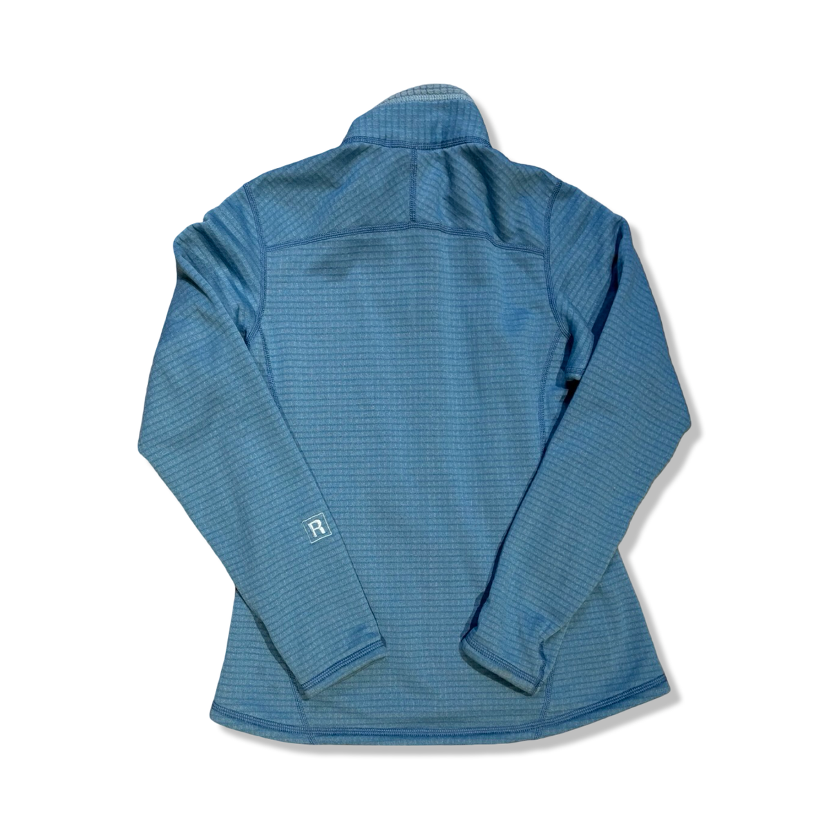 Light blue Patagonia women's grid-fleece cardigan, back view against a white background.