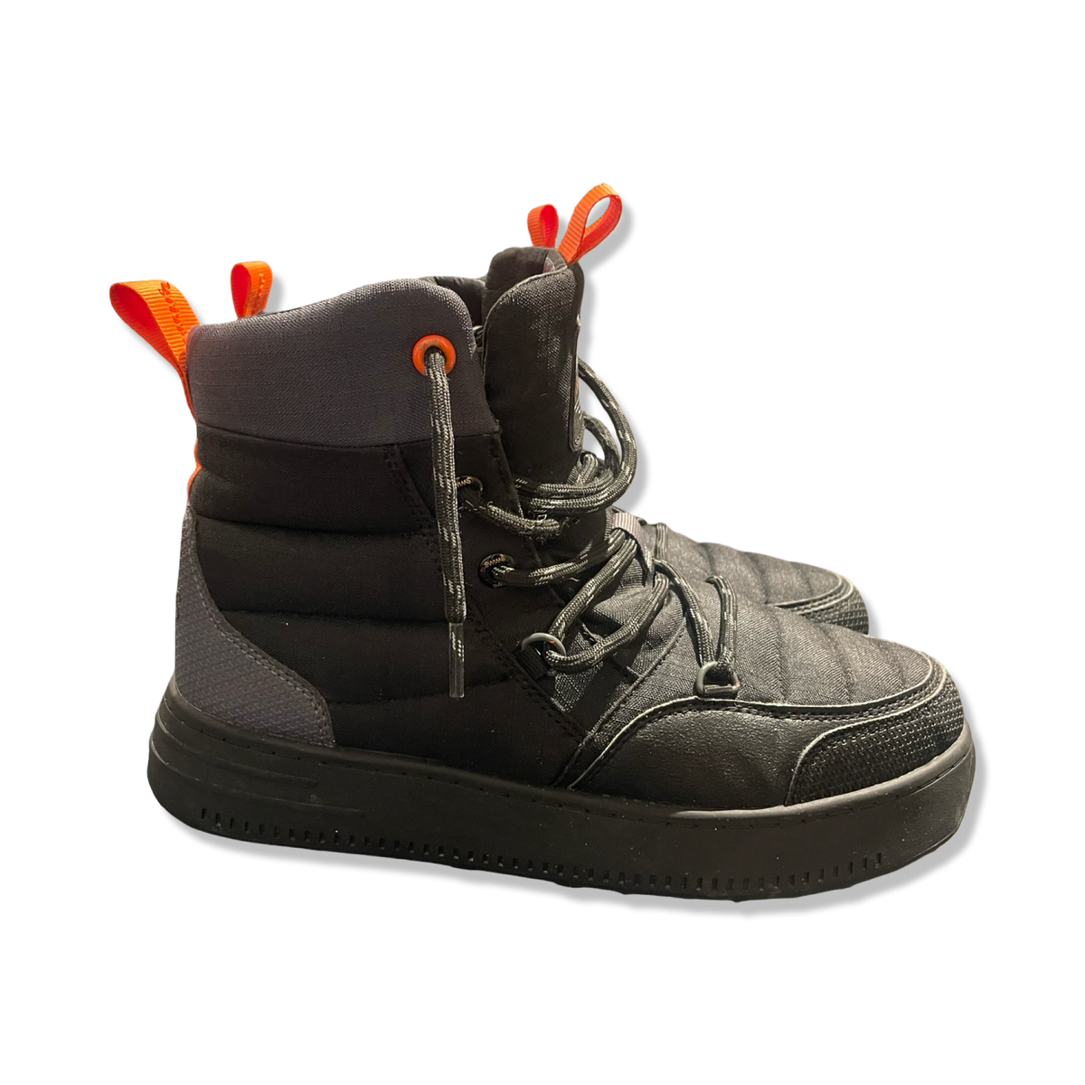 A pair of black Swims snow boots with orange details, side view against a white background.