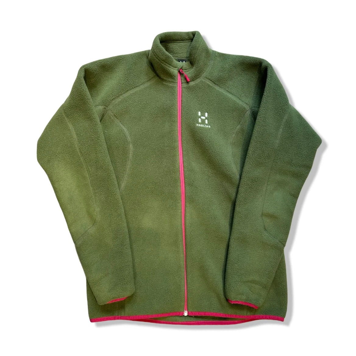 Green Haglöfs women's zip-up fleece jacket, front view against a white background.