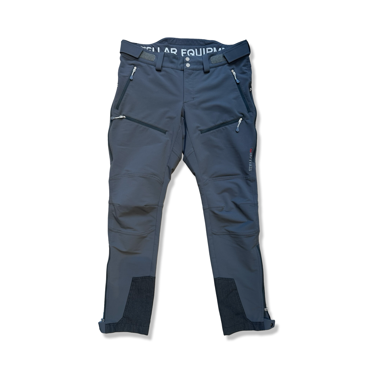 Grey Stellar Equipment women's softshell pants with zipper pockets, front view against a white background.