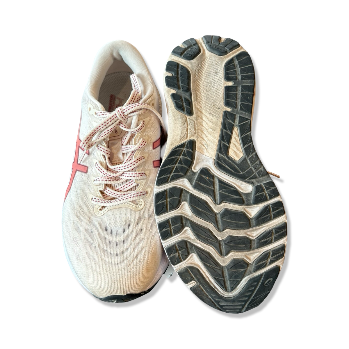 Beige löparskor Asics GT-2000 11 för dam, visade uppifrån och med undersidan mot vit bakgrund.