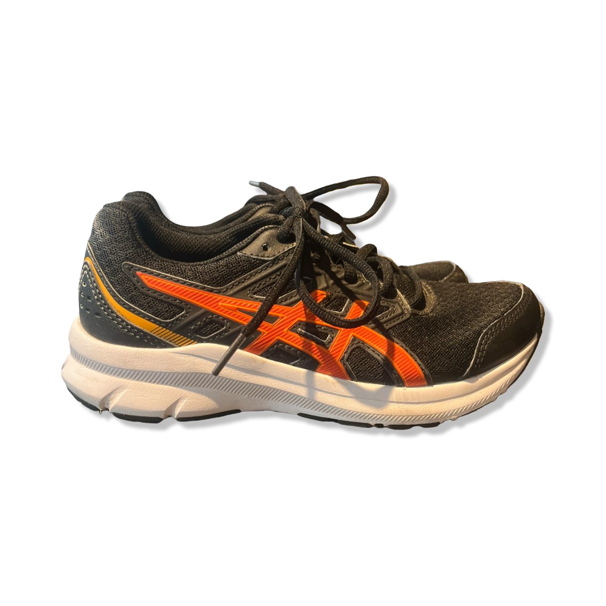 Black Asics women's running shoe with orange details, laces and white cushioned sole, side view.