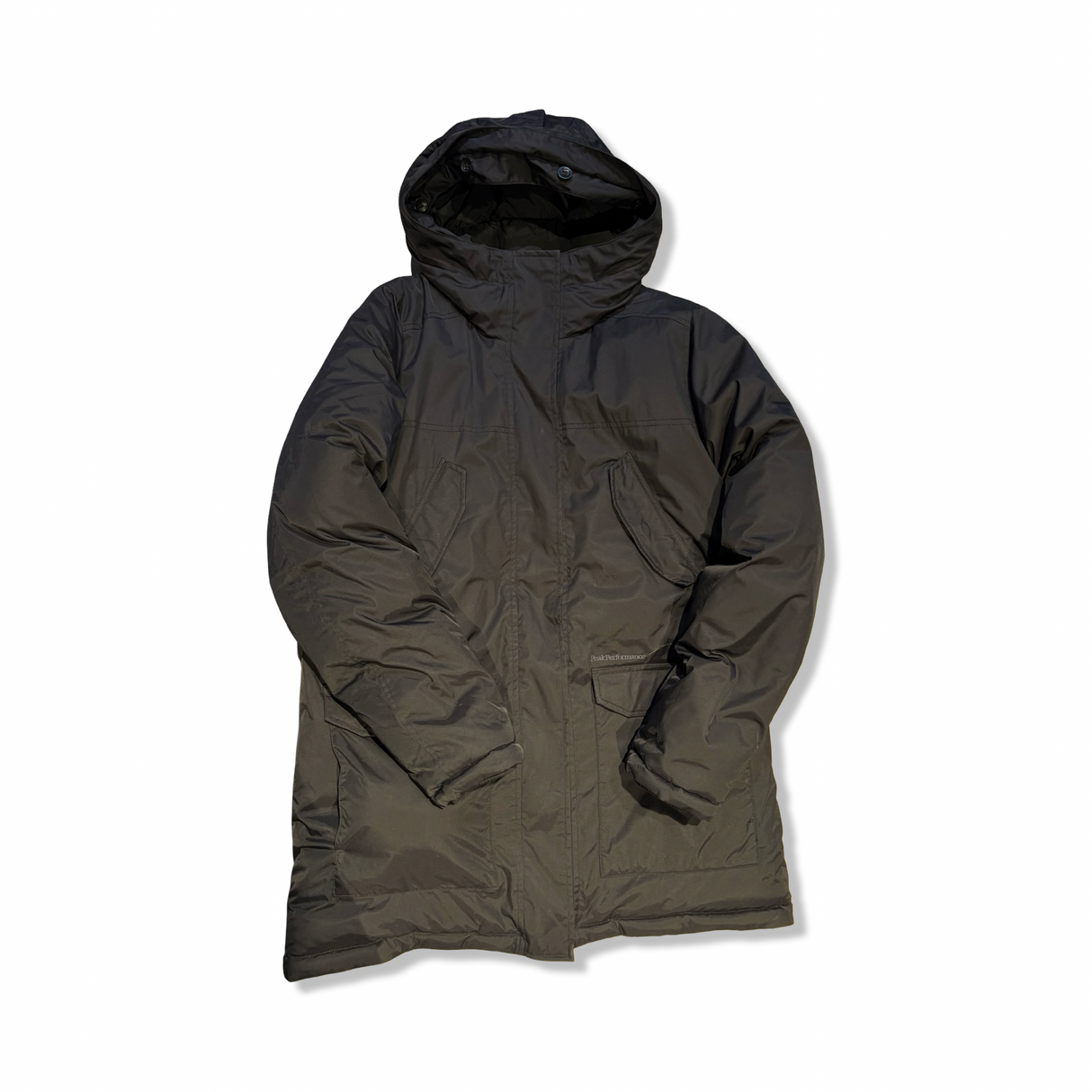 Black women's down jacket from Peak Performance with a hood, photographed from the front against a white background.