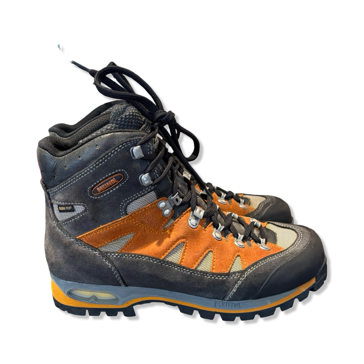 Meindl Air Revolution 3.1 hiking boots in orange and grey suede, side view on a white background.