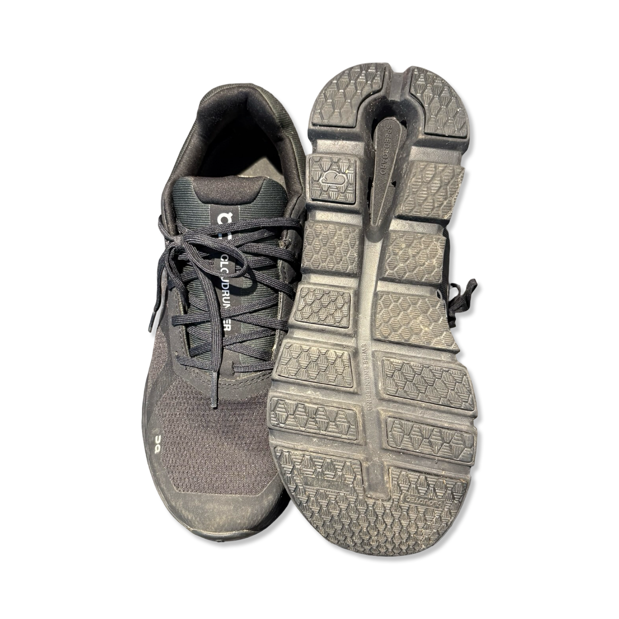 Black ON Cloudrunner men's running shoes, shown from the front and with the sole facing upward against a white background.