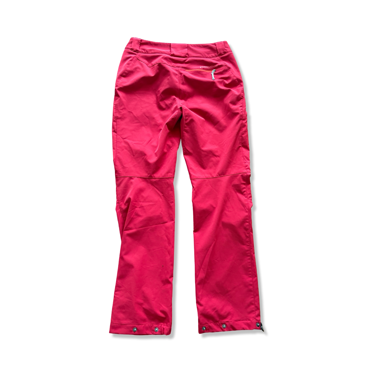 Red Houdini women's hiking trousers, rear view against a white background.