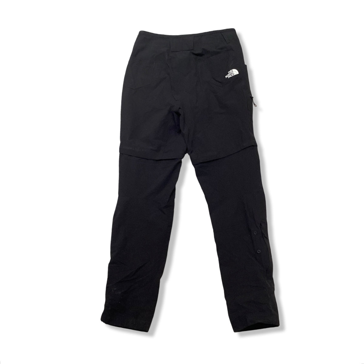 Back view of a pair of black The North Face women's base layer pants against a white background.