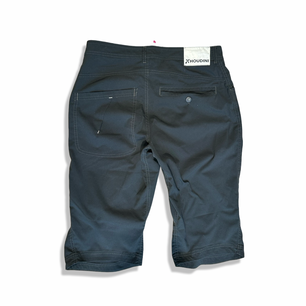 Baksidan av blå Houdini-shorts för dam i modell M, fotograferade mot en vit bakgrund.