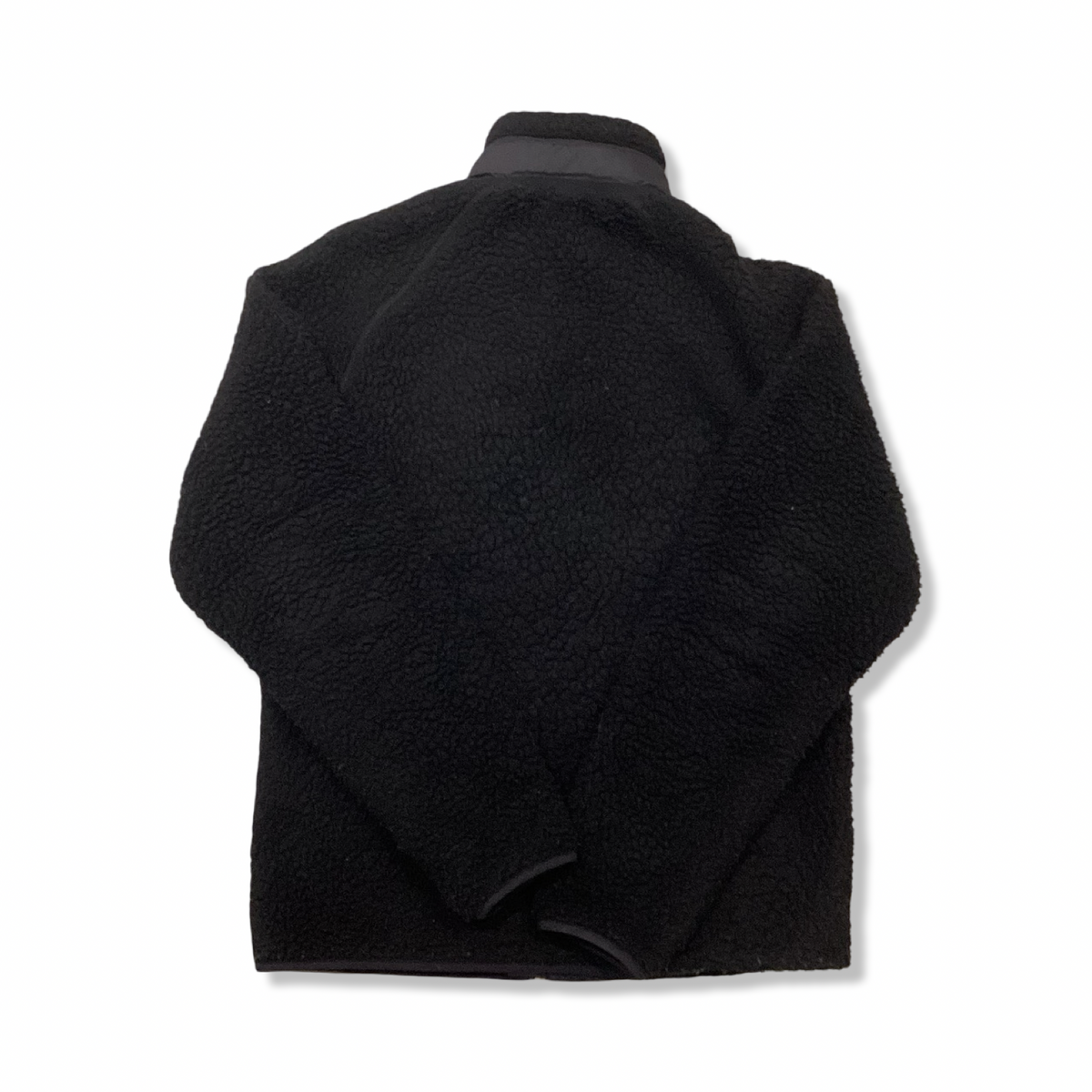 Baksidan av en svart Carhartt fleececardigan för dam, fotograferad mot en vit bakgrund.