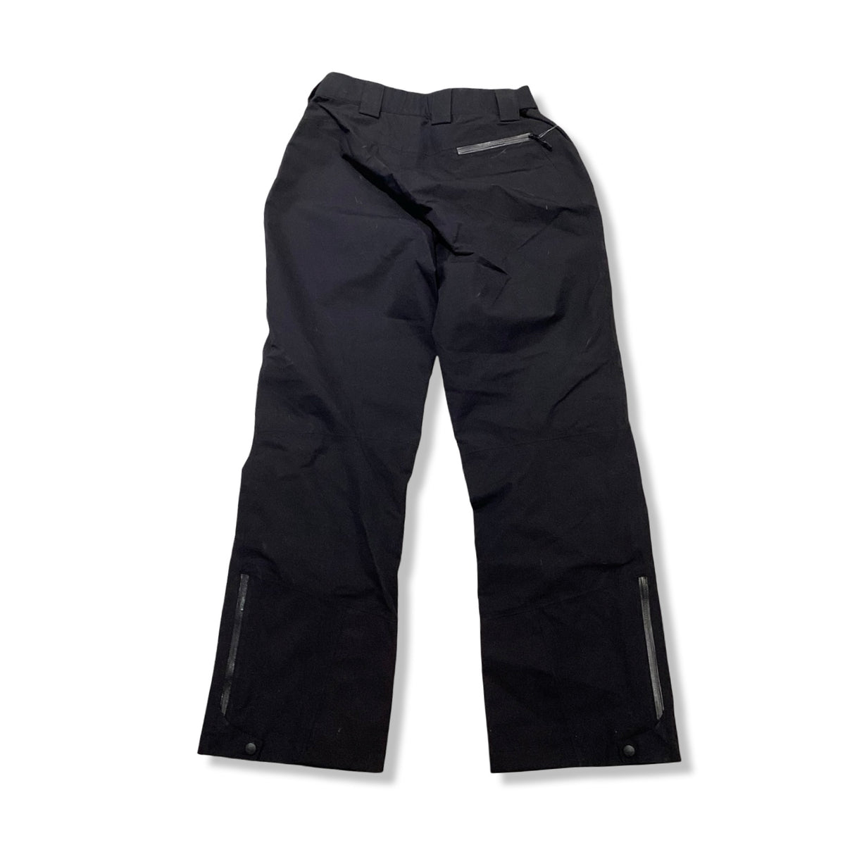 Back view of a pair of black Marmot women's shell pants against a white background.