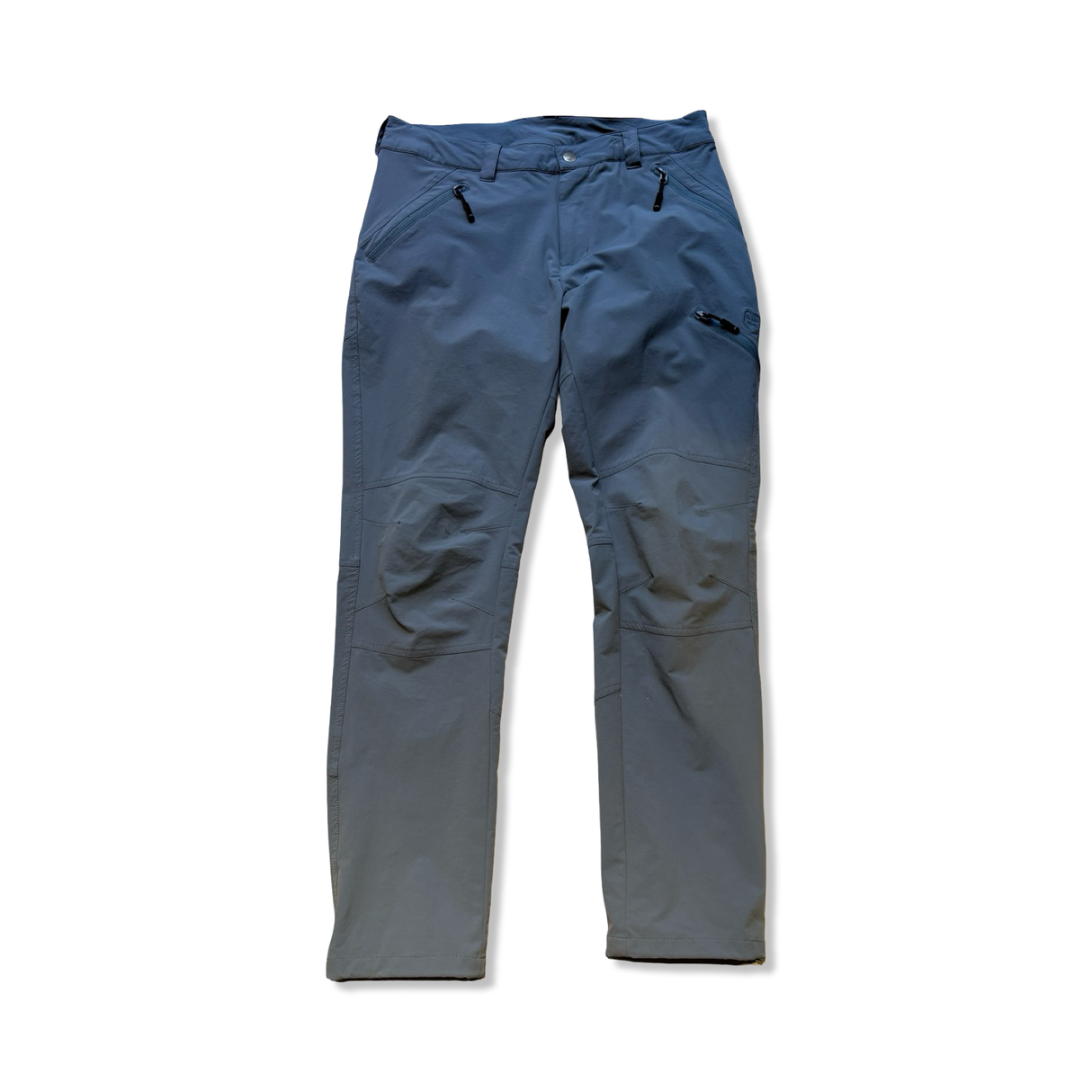 Blue men's functional pants with zipped pockets, photographed from the front on a white background.