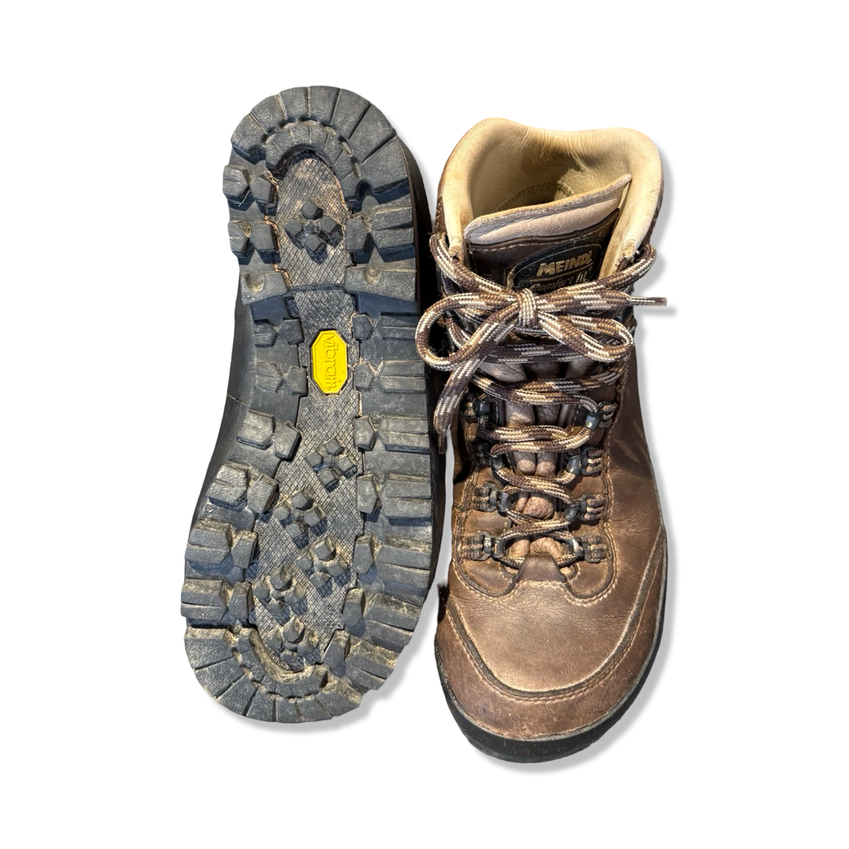 Brown Meindl women's boots with visible sole, photographed from the front and underneath against a white background.