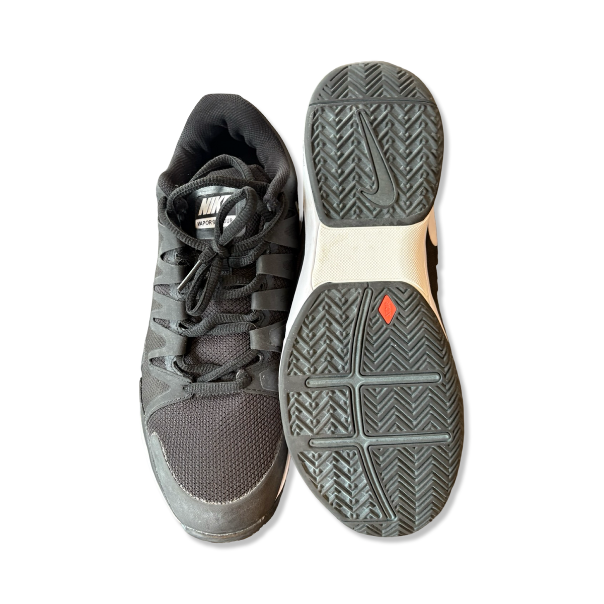 Black Nike Zoom Vapor 9.5 Tour men's training shoes, shown from above with one sole and one upper against a white background.