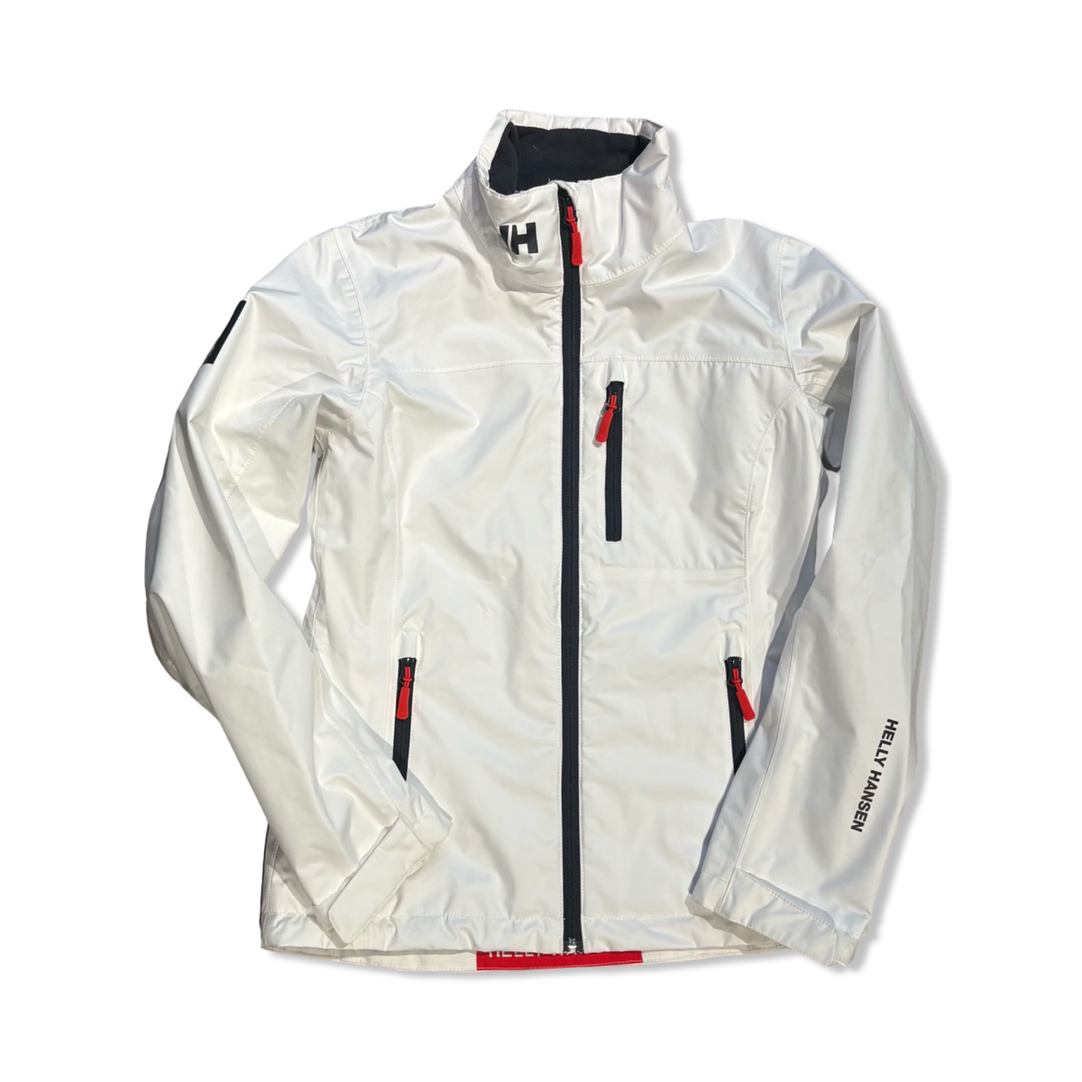 White Helly Hansen women's Crew Sailing Jacket 2.0 with zipper, front view against a white background.