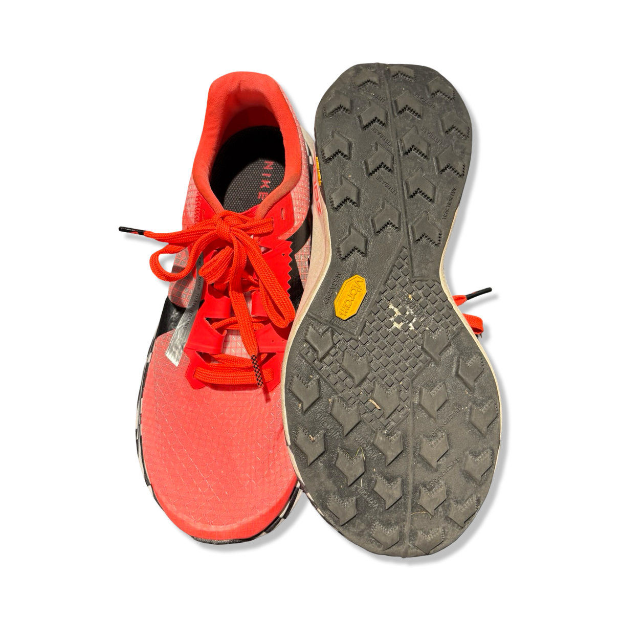 Orange unisex Nike ZoomX Ultrafly Trail running shoes with visible sole, photographed from the front and underneath against a white background.