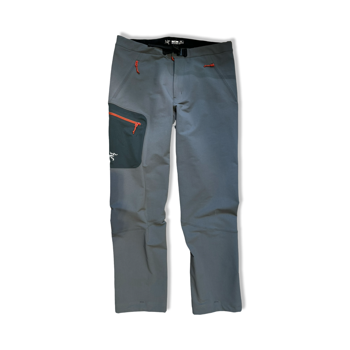 Grey Arc'teryx Gamma MX men's softshell pants with orange zippers, front view against a white background.