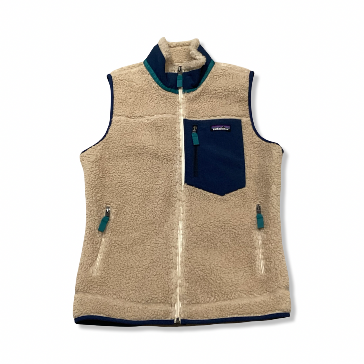 Beige och blå Patagonia Classic Retro-X väst för dam, fotograferad framifrån mot en vit bakgrund.