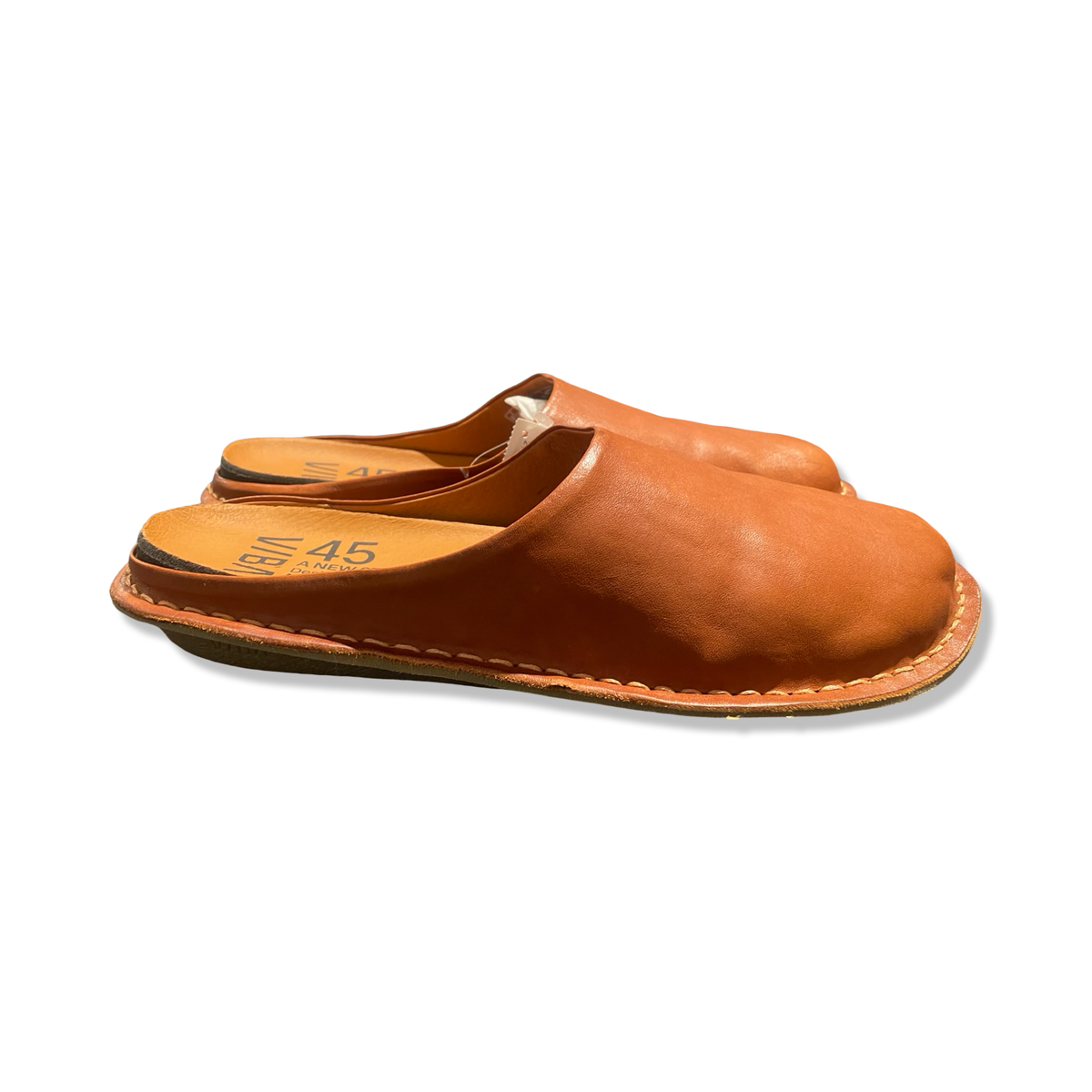 Brown leather men's slippers from Viba, side view against a white background.