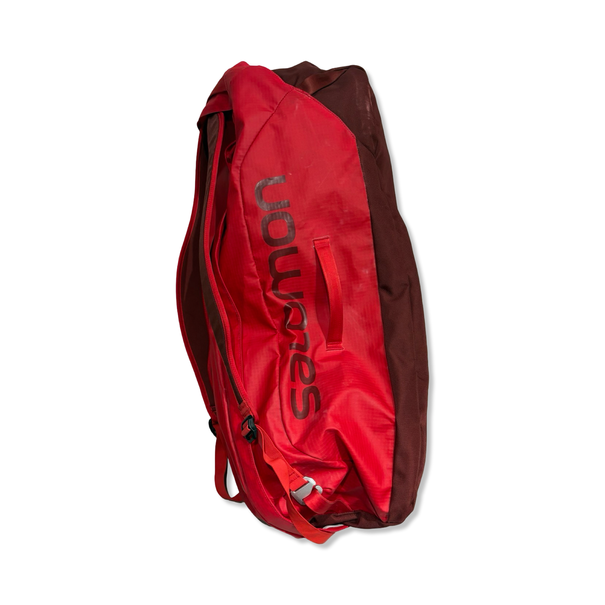 Red Salomon Outlife bag photographed from the side against a white background.