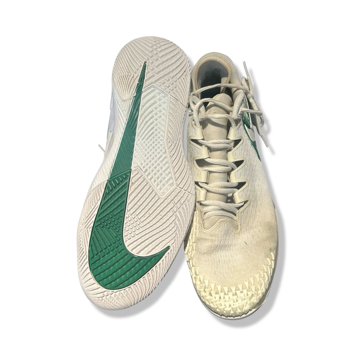 White and green Nike NikeCourt Air Zoom Vapor X Knit men's athletic shoes, viewed from above against a white background.