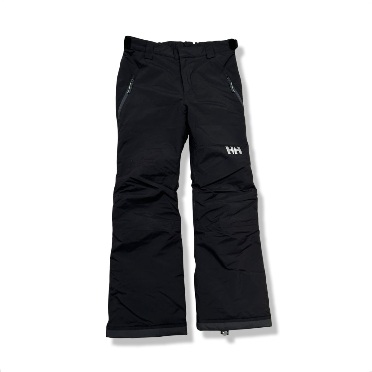 Black Helly Hansen kids' ski pants with zippered pockets, front view against a white background.