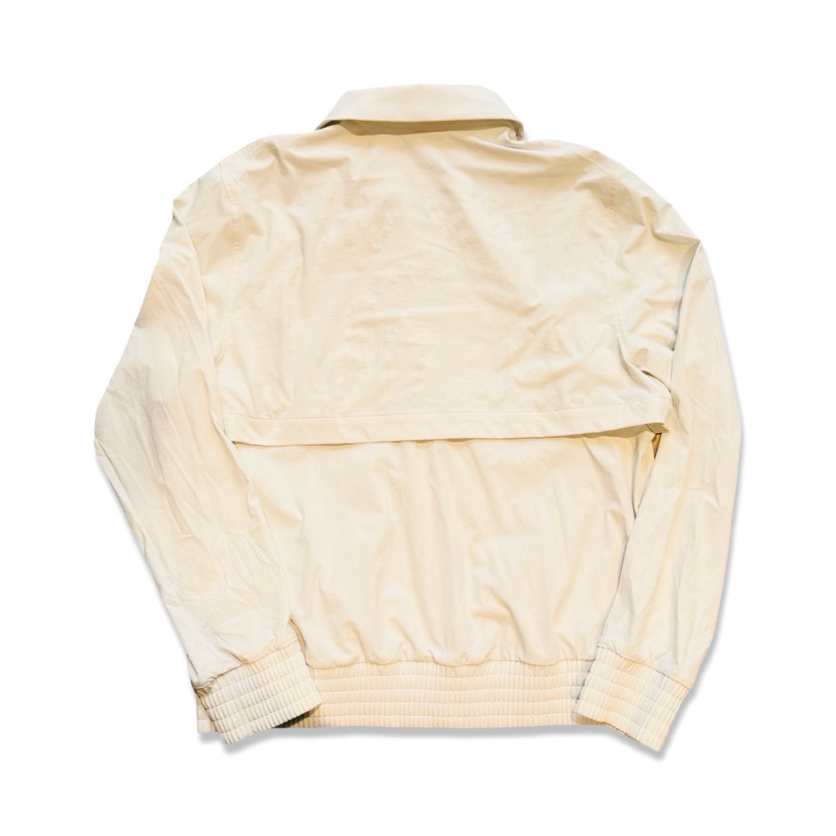 Off-white Lululemon training jacket with a back vent, rear view against a white background.