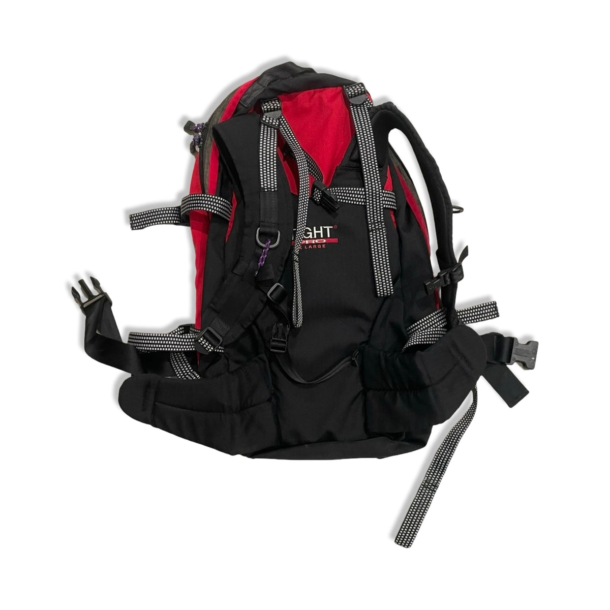 Back view of a black and red Haglöfs backpack with shoulder straps and hip belt against a white background.