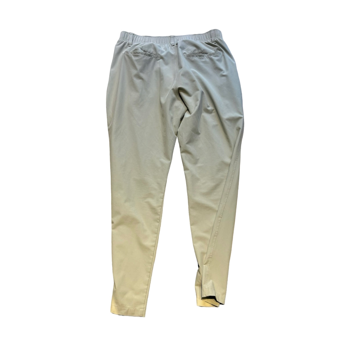 Beige träningsbyxor från Under Armour i storlek XL sedda bakifrån mot en vit bakgrund.