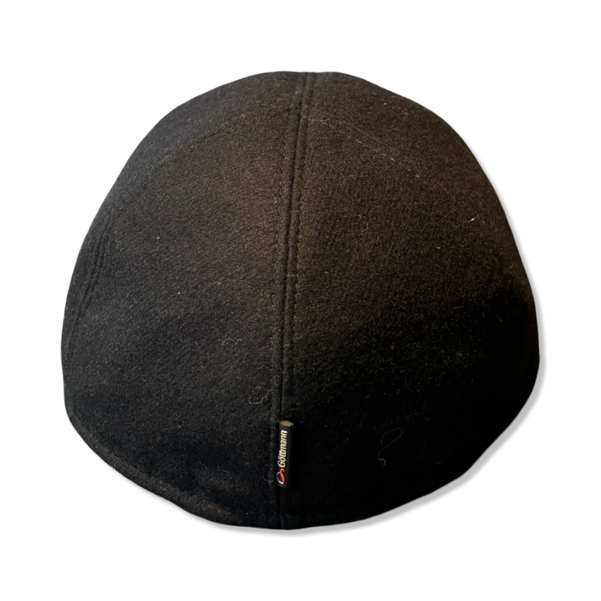 Black Göttmann Monaco KG baseball cap with a small logo tag, rear view against a white background.