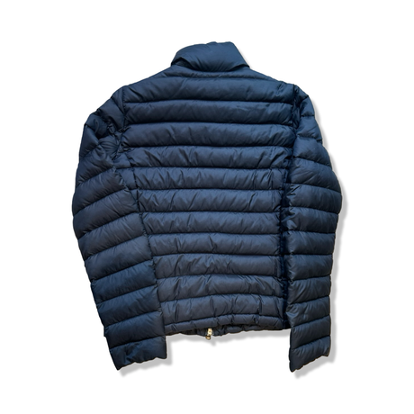 Back view of a blue Woolrich down jacket in size L, photographed against a white background.
