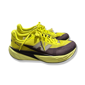 Yellow New Balance FuelCell Rebel running shoes in size 42, side view against a white background.