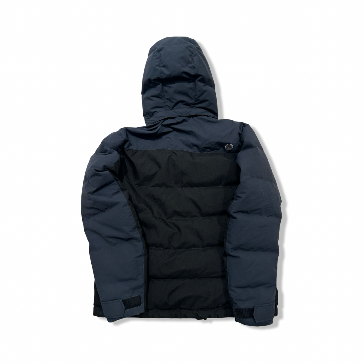 Back view of a black Marmot women's down jacket against a white background.