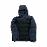 Back view of a black Marmot women's down jacket against a white background.
