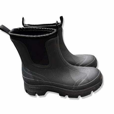 Black Tretorn women's Terrain Low Neo rubber boots, side view against a white background.