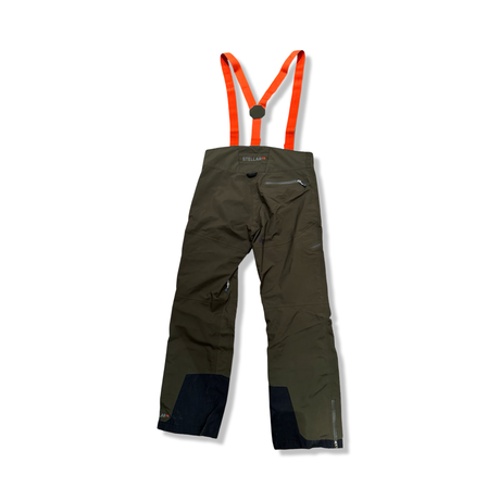 Back view of green Stellar Equipment shell pants with suspenders against a white background.