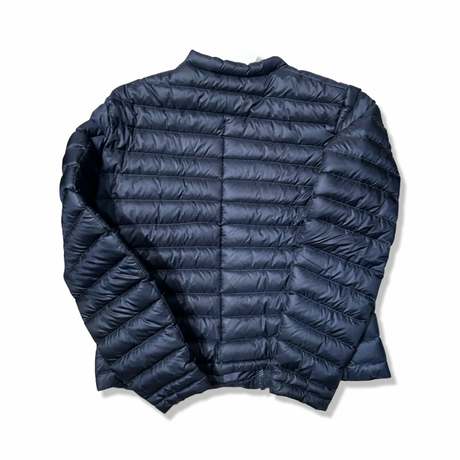 Back view of a blue Peak Performance women's down jacket against a white background.