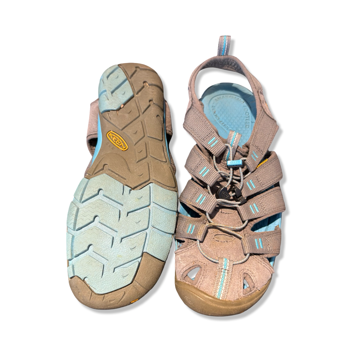 Blue and grey women's Keen Clearwater Cnx sandals with visible sole, photographed from the front and underneath against a white background.