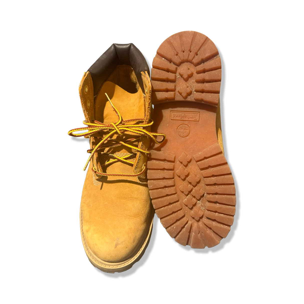Brown Timberland women's boots, shown from above with focus on the rugged outsole and laces against a white background.