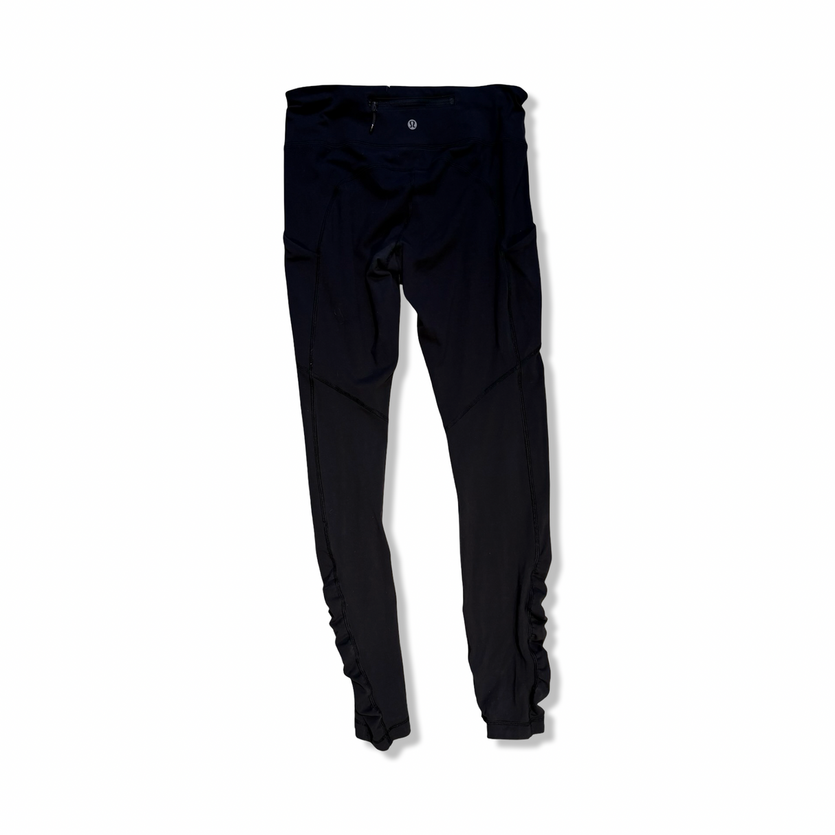 Black Lululemon women's training tights, back view against a white background.
