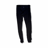 Black Lululemon women's training tights, back view against a white background.