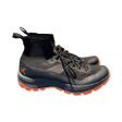 Black Arc'teryx women's Vertex trail running hiking shoes with orange details, side view against a white background.