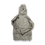 Back view of a beige and grey Klättermusen women's hooded down jacket against a white background.