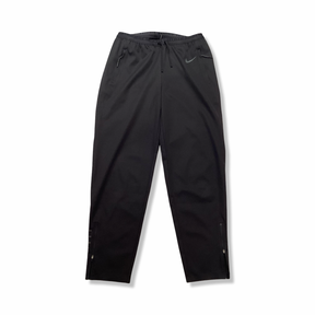 Black Nike women's training pants, front view against a white background.