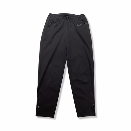Black Nike women's training pants, front view against a white background.