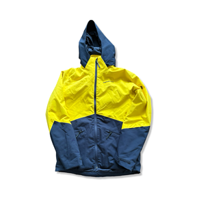 Yellow and blue unisex ski jacket with hood from Peak Performance, front view against a white background.