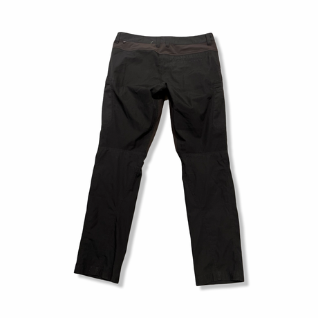Grey Lundhags women's hiking pants, back view against a white background.