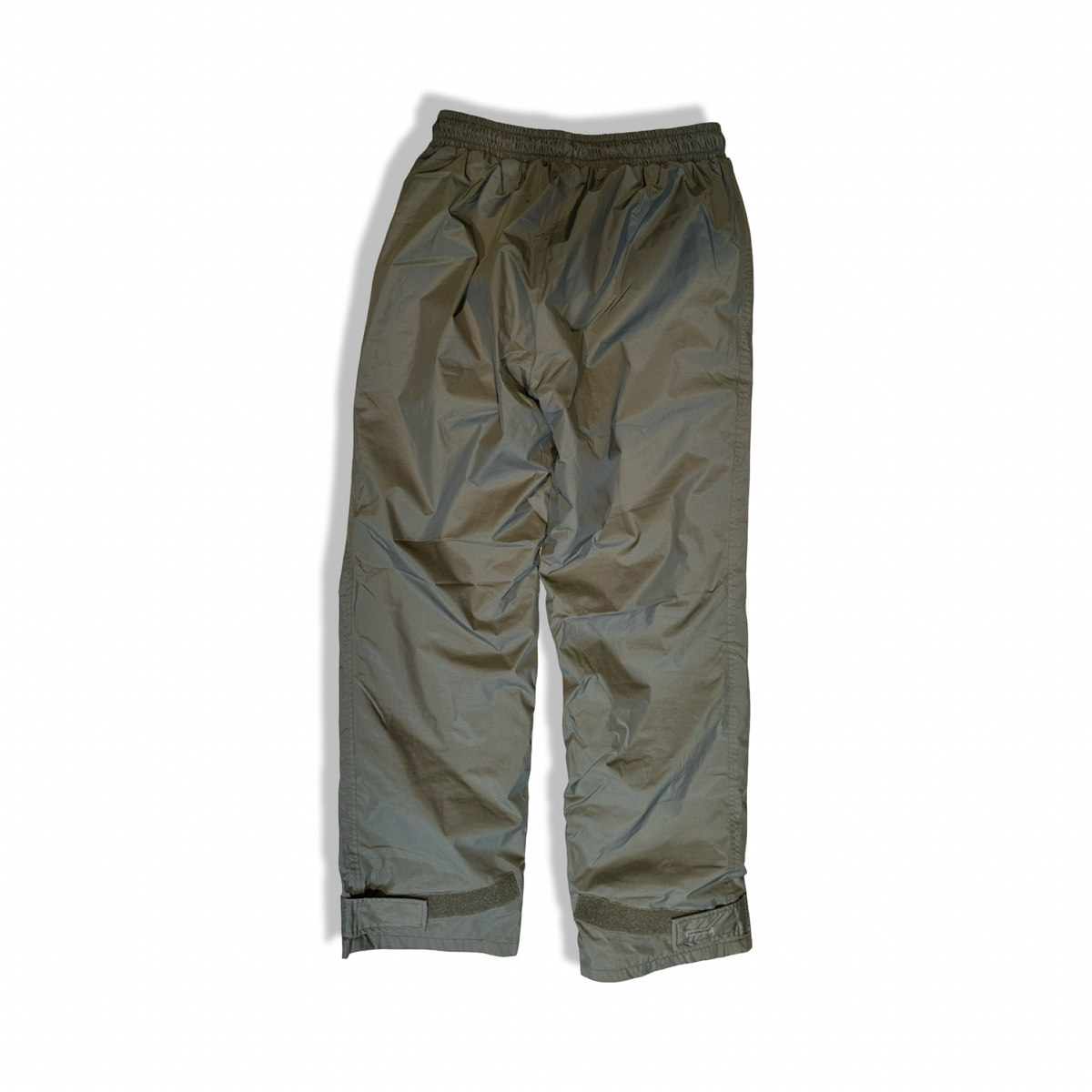 Back view of a green Fjällräven women's shell pants in size S against a white background.
